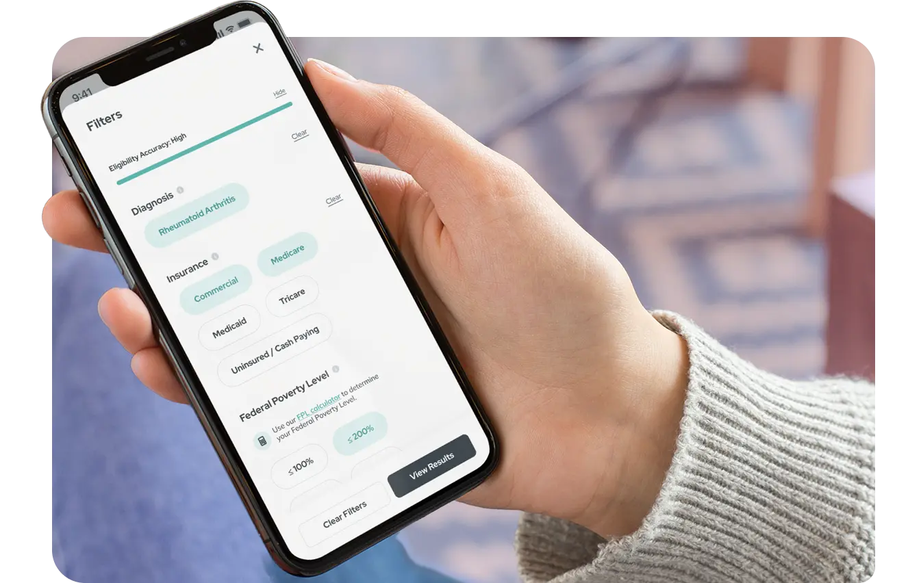 Hand holding a phone with eligibility filters